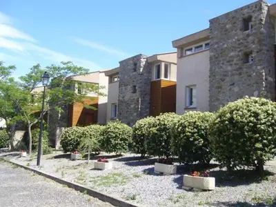 a building with a bunch of bushes in front of it at La trillano in Trilla