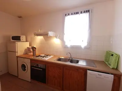 a small kitchen with a sink and a window at La trillano in Trilla