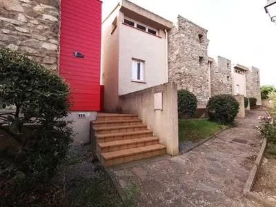 a red building with stairs in front of it at La trillano in Trilla