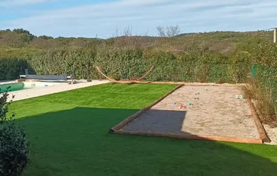 an aerial view of a lawn with a pool at Awesome Home In Pardailhan With Kitchen in Pardailhan