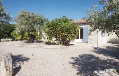a house with trees in front of a driveway at Stunning Home In Ferrals Les Corbières in Ferrals-lès-Corbières