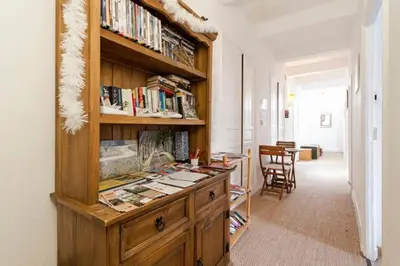 a room with a library with a desk with books at Chez Shona in Lagrasse