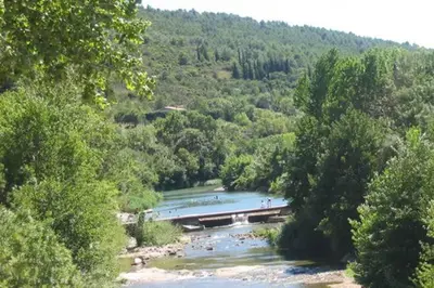 a view of a river with people swimming in it at Chez Shona in Lagrasse