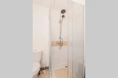 a bathroom with a shower and a toilet at Chez Shona in Lagrasse