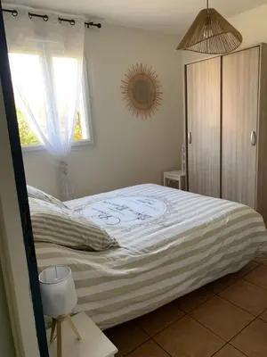 a bedroom with a large bed with a window at bienvenue chez nous in Badens