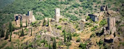 an old castle on top of a hill with trees at bienvenue chez nous in Badens