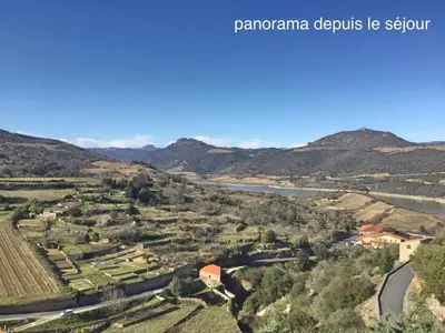 a view of a valley with a river and mountains at Horizon Caramany : un havre de douceur, vue lac ! in Caramany