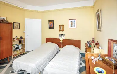a bedroom with two beds in a room at 2 Bedroom Gorgeous Home In Carcassonne in Carcassonne