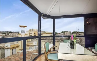 a view from the balcony of a apartment with a table and chairs at 2 Bedroom Gorgeous Home In Carcassonne in Carcassonne