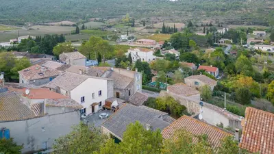 an aerial view of a village with roofs at Maison accueillante avec jardin à Albas in Albas