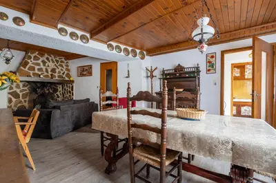 a living room with a table and a couch at Maison accueillante avec jardin à Albas in Albas