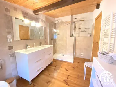 a bathroom with a white sink and a shower at Dame nature in La Tourette-Cabardès