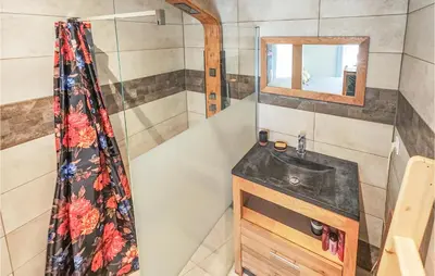 a bathroom with a sink and a mirror at Cozy Home In Saint-Jean-De-Minervoi in Saint-Jean-de-Minervois