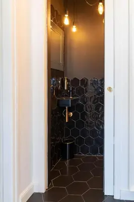 a bathroom with a sink and a mirror at Magnifique loft / spa en face de la cathédrale ! in Narbonne
