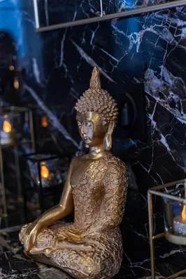 a bronze statue of a woman sitting on the ground at Magnifique loft / spa en face de la cathédrale ! in Narbonne