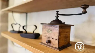 a wooden box sitting on top of a wooden shelf at Le cazal in Sainte-Eulalie
