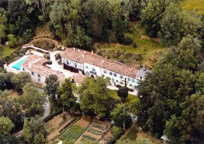 an aerial view of a house with a swimming pool at The Gatehouse in Castres