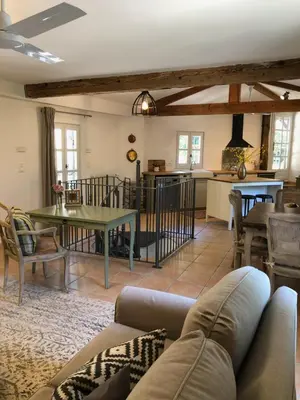 a living room with a couch and a table at The Gatehouse in Castres