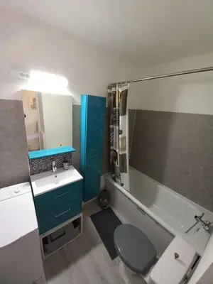 a bathroom with a toilet and a sink at Studio Balcon Proche Hypercentre de Narbonne in Narbonne