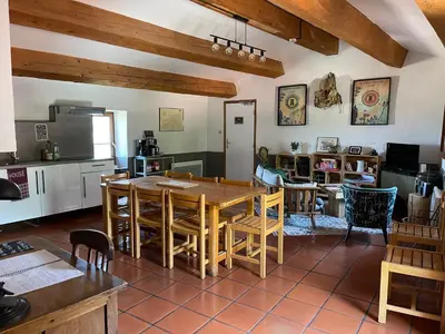 a kitchen and dining room with a table and chairs at Gîte XL Familles et groupes Duilhac sous Peyrepertuse in Duilhac