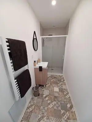 a bathroom with a sink and a shower at Mazamet - Studio neuf et moderne en centre-ville in Mazamet