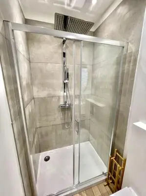 a shower with a glass door in a bathroom at NEW, La Passante, Belle vue in Conques-sur-Orbiel