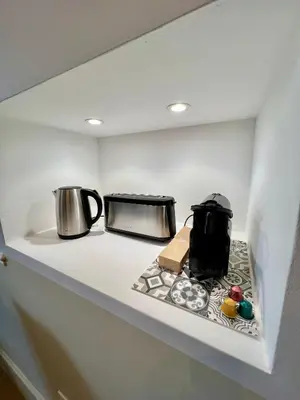 a kitchen counter with two pots and a toaster at NEW, La Passante, Belle vue in Conques-sur-Orbiel
