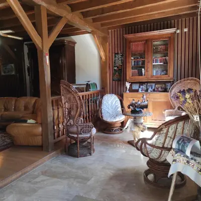 a living room with chairs and a table at Villa Aimé in Caunes-Minervois