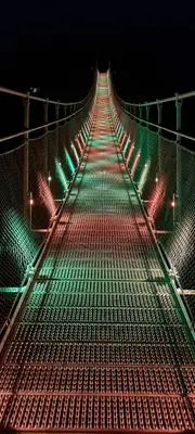 a walkway lit up with christmas lights at night at Mazamet : Résidence du Musée centre ville. in Mazamet
