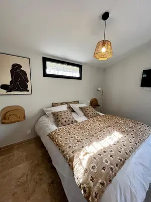 a bedroom with a large bed in a room at Le Donjon de Lily - Cœur de La Cité Médiévale in Carcassonne