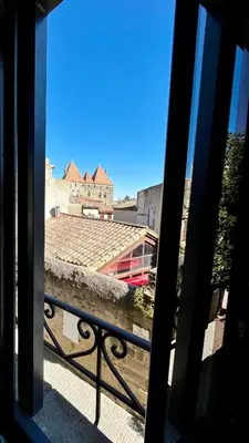 a view of a building from a balcony at Le Donjon de Lily - Cœur de La Cité Médiévale in Carcassonne