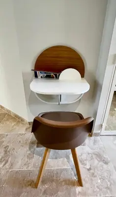 a brown chair sitting in a room at Le Donjon de Lily - Cœur de La Cité Médiévale in Carcassonne