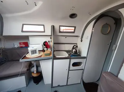 an interior view of a small kitchen in an airplane at St Helene in Gruissan