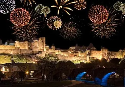 a view of a castle with fireworks in the sky at Rooftop Standing Place Carnot in Carcassonne