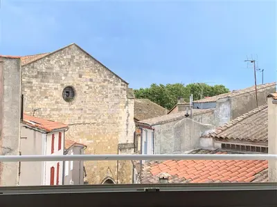 a view of a city from a window at Le Lamourguier in Narbonne