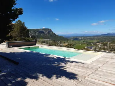 a swimming pool with a view of a mountain at Lodge d'Œnotourisme avec vue imprenable ! in Vingrau