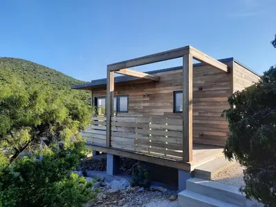a modern house with a wooden exterior at Lodge d'Œnotourisme avec vue imprenable ! in Vingrau