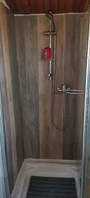 a bathroom with a shower with a shower at Chalet en bois 