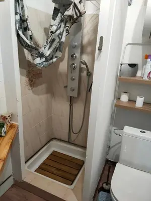 a shower in a bathroom with a toilet at Le quai in Port-la-Nouvelle