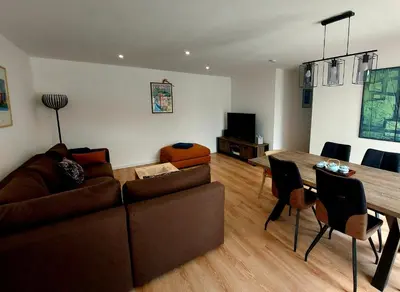 a living room with a couch and a table at La Belle Vie en Alaric in Douzens