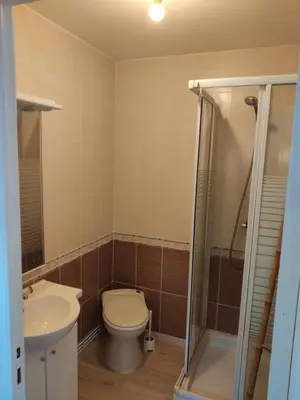 a bathroom with a toilet and a sink and a shower at Adorable guest house with piscine and spa in Lempaut
