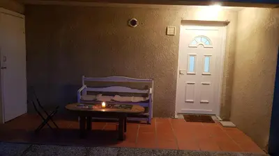 a room with a door and a table with a candle at Sur les pas de Pierre Paul Riquet in Montferrand