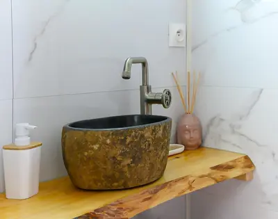 a sink with a faucet on a wooden shelf at Péniche Dondon - Gîte cocooning sur Canal du midi in Avignonet-de-Lauragais