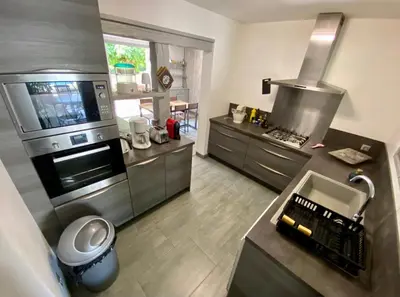 an aerial view of a kitchen with a stove at Belle et grande villa pour des séjours en famille et entre amis in Cruscades