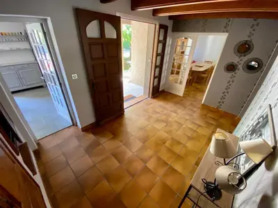 an overhead view of a kitchen and a hallway with a door at Belle et grande villa pour des séjours en famille et entre amis in Cruscades