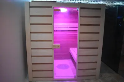 a room with a sauna with purple lights at Gite a la ferme avec jacuzzi et sauna in Villefloure