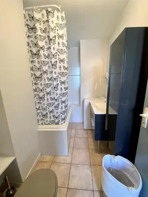 a bathroom with a toilet and a sink at Le Gîte du Canal, à Homps. in Homps