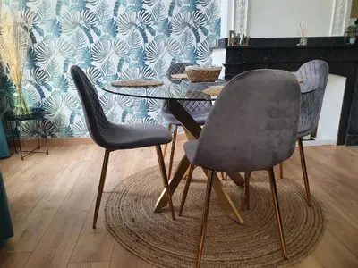 two chairs and a table in a room at A l ombre des remparts 3 in Carcassonne