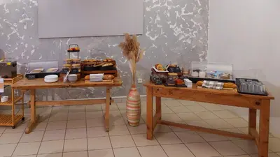 a table with plates and food on top of it at Logis hôtel restaurant Le clos saint loup in Bram