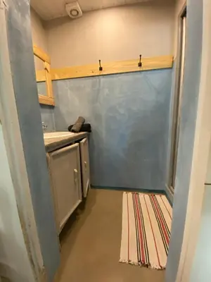 a kitchen with a sliding door in a room at Joli gîte chic et cosy entre mer et Narbonne in Narbonne